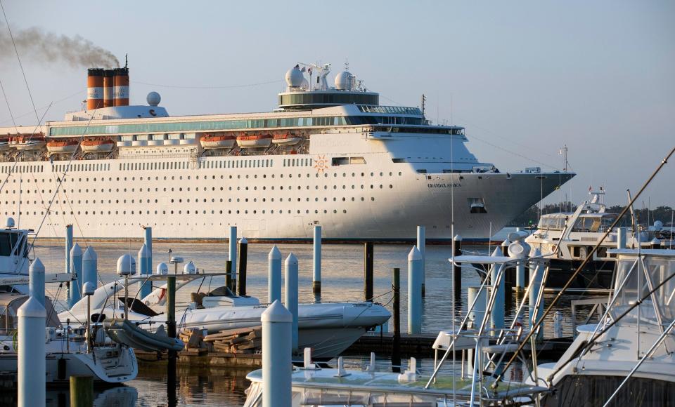 The Grand Classica returns to the Port of Palm Beach past boats in the Riviera Beach Marina.