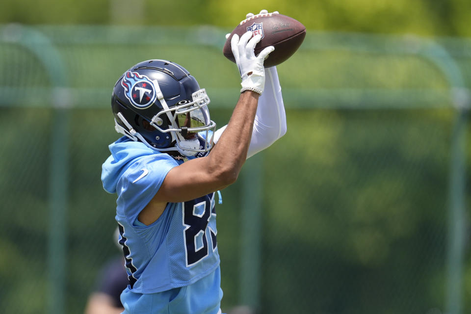 Tennessee Titans wide receiver Tyler Boyd makes a catch during NFL football practice Wednesday, May 29, 2024, in Nashville, Tenn. (AP Photo/George Walker IV)