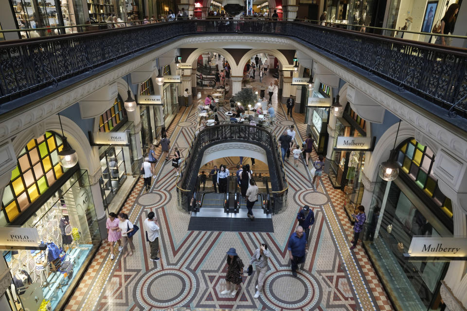 People walk through a shopping center in Sydney, Wednesday, Jan. 31, 2024. The Australian Bureau of Statistics said the latest consumers price index, or CPI, fell to 4.1%, down from 5.4% in September. (AP Photo/Rick Rycroft)