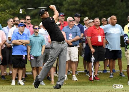 Aug 11, 2017; Charlotte, NC, USA; Kevin Kisner tees off on the 13th hole during the second round of the 2017 PGA Championship at Quail Hollow Club. Mandatory Credit: Michael Madrid-USA TODAY Sports