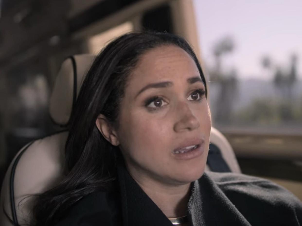 Meghan Markle discusses never being treated like a Black woman before moving to the UK in the "Harry and Meghan" docuseries.