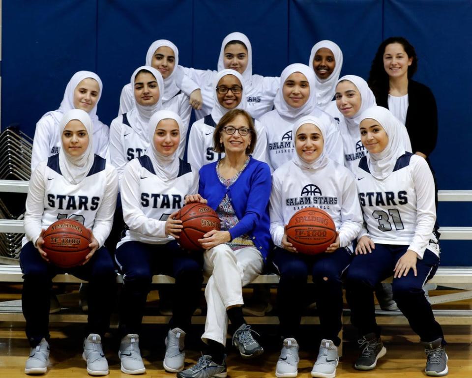 Former Journal Sentinel reporter Anyssa Johnson and Salam School girls basketball team in 2018.