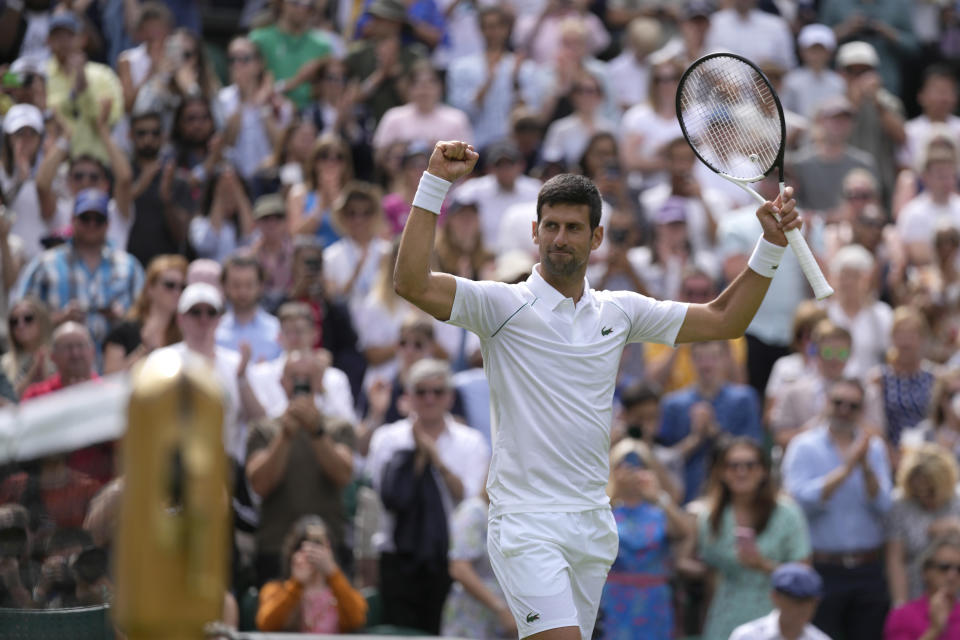 FILE - Serbia's Novak Djokovic celebrates defeating Australia's Thanasi Kokkinakis in a singles tennis match on day three of the Wimbledon tennis championships in London, Wednesday, June 29, 2022. Reigning Wimbledon champion Novak Djokovic famously decided not to get vaccinated against COVID-19 — which prevented him from playing at the Australian Open in January following a legal saga that ended with his deportation from that country, and, as things currently stand, will prevent him from entering the United States to compete at the U.S. Open in August. (AP Photo/Alastair Grant, File)