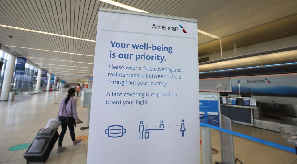 Signs are placed throughout the Greater Rochester International Airport reminding customers to wear a mask and practice social distancing, Friday, July 24, 2020. 