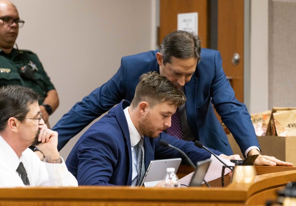 Defendant Christopher Alan Smith, left, watches and listens as Jameson Karnes, center and Defense Attorney Michael Nappi, right, both with the Office of Criminal Conflict and Civil Regional Counsel, discuss something during the Christopher Alan Smith trial Wednesday October 11, 2023. Smith is charged with second degree murder and aggravated battery with a deadly weapon. He's accused of killing Amy Scott. The trial was being held in Judge Peter Bringham’s courtroom at the Marion County Judicial Center in Ocala, Fla. [Doug Engle/Ocala Star Banner]2023