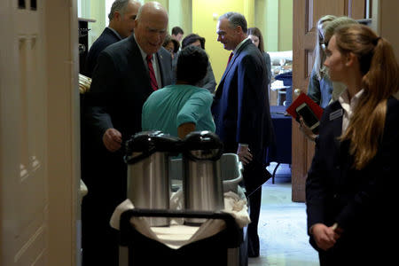 U.S. Senator Tim Kaine (D-VA) (C) is greeted by fellow senators as he arrives for Senate Democratic party leadership elections at the U.S. Capitol in Washington, DC, U.S. November 16, 2016. REUTERS/Jonathan Ernst