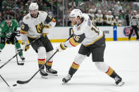 Vegas Golden Knights defenseman Noah Hanifin slaps a scoring shot against the Dallas Stars during the second period in Game 2 of an NHL hockey Stanley Cup first-round playoff series in Dallas, Wednesday, April 24, 2024. (AP Photo/Tony Gutierrez)