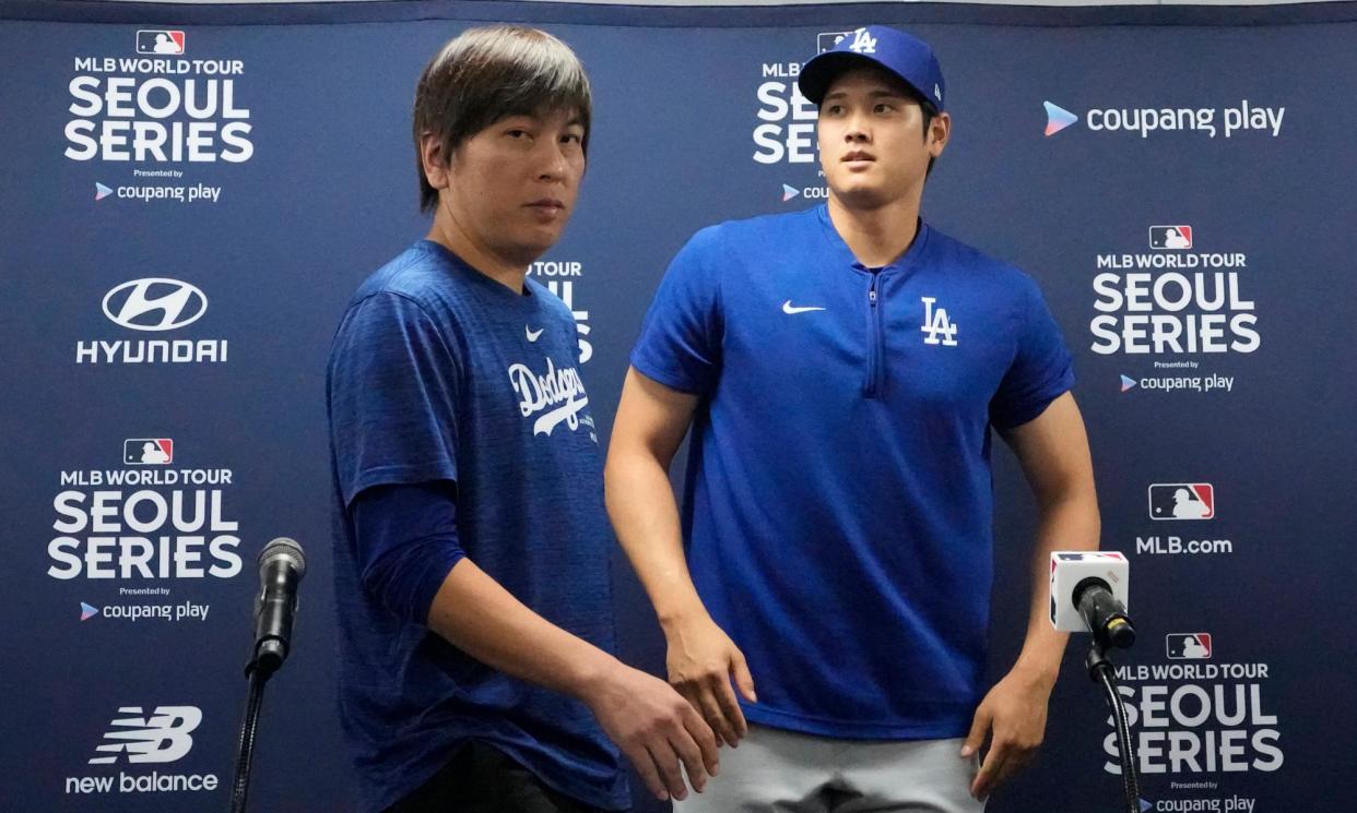 <span>Shohei Ohtani, right, and his former interpreter, Ippei Mizuhara, were in Seoul for the start of the MLB season. </span><span>Photograph: Lee Jin-man/AP</span>