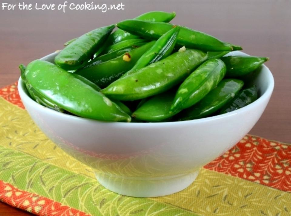 <p>Sugar snap peas don’t need much to make them taste good. In fact, they shine with a simple sauté in canola oil with crushed red pepper flakes, garlic and ginger.</p><p><strong>Get the recipe: <a href="http://www.fortheloveofcooking.net/2014/06/spicy-sugar-snap-pea-saute-with-garlic-and-ginger.html" rel="nofollow noopener" target="_blank" data-ylk="slk:Spicy Sugar Snap Pea Sauté with Garlic and Ginger;elm:context_link;itc:0;sec:content-canvas" class="link ">Spicy Sugar Snap Pea Sauté with Garlic and Ginger</a></strong></p>