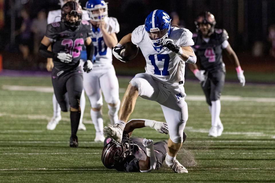 McCallie's Carson Gentle (17) avoids being tackled by a Lipscomb defender during their game against ? Friday, Oct. 27, 2023, in Nashville, Tenn. (Wade Payne for The Tennessean)