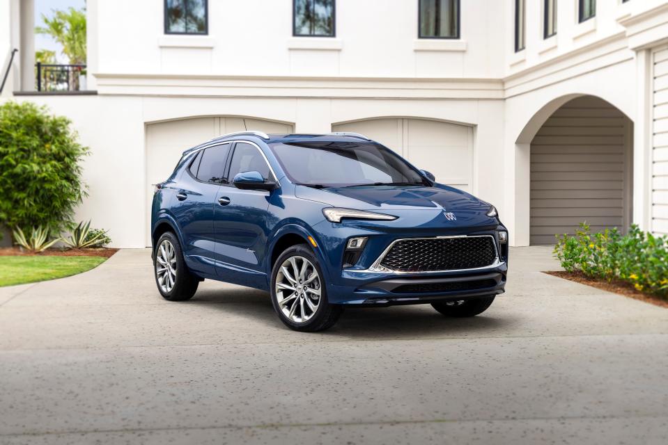 A front three-quarters view of the 2024 Buick Encore GX Avenir in Ocean Blue Metallic. Preproduction model shown. Actual production model may vary. Available in spring 2023.