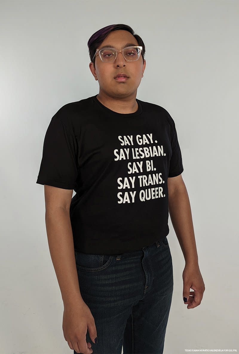 Sameer Jha wears a black t shirt with white text that reads, 