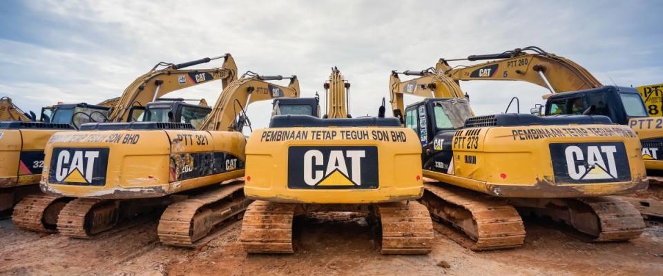 Modern hydraulic excavator on a field work site where an excavation works is performed in Kuala Lumpur, Malaysia.