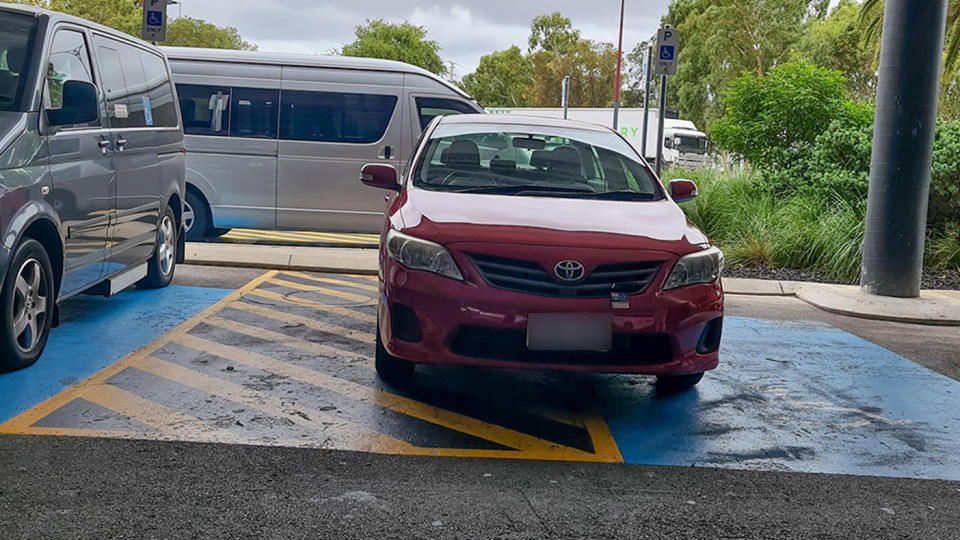 A driver parked in a shared space, prevent access to those who need the disabled parking spaces. Source: Facebook/Australian Disability Parking Wall of Shame