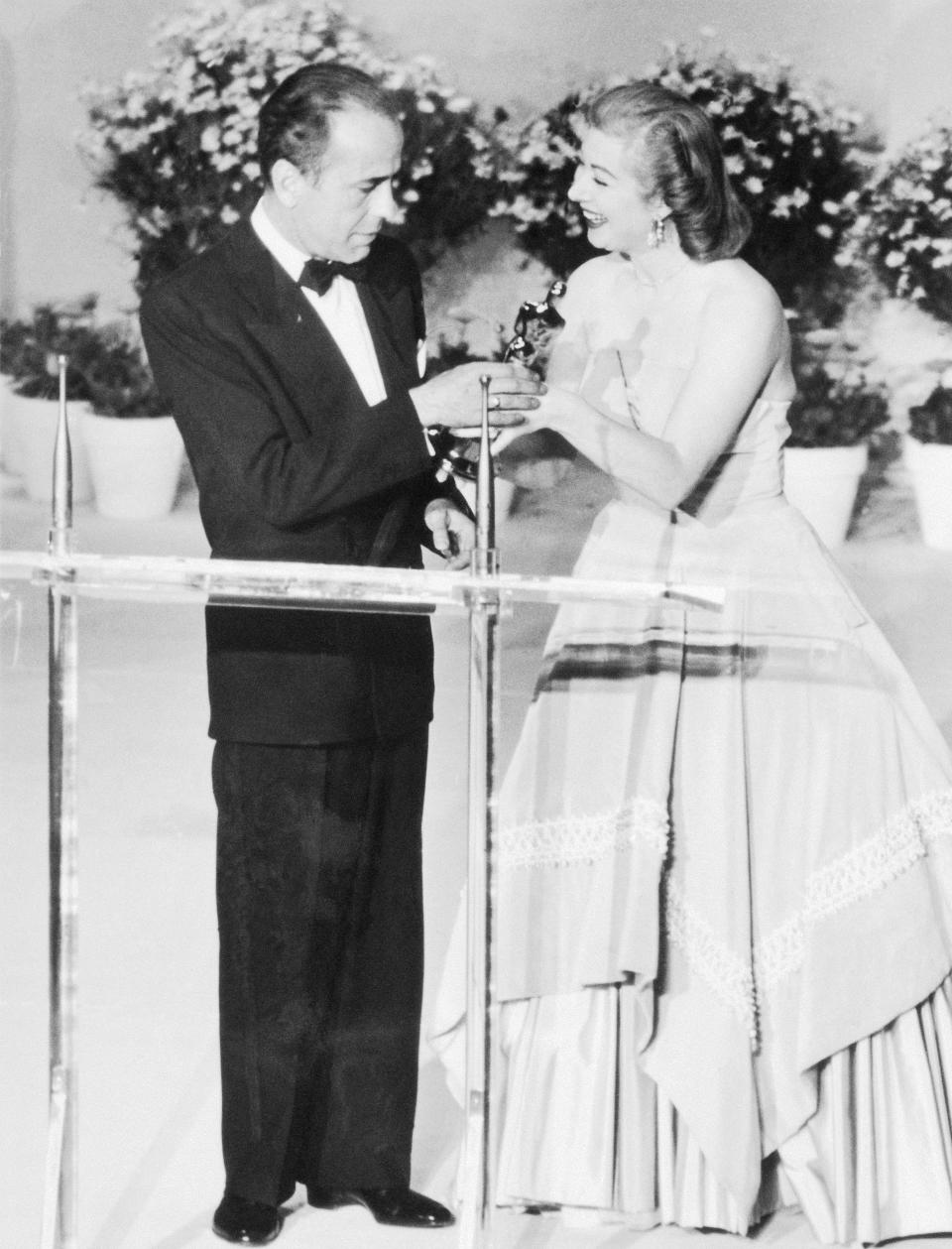 (Original Caption) An Oscar for Bogart...Humphrey Bogart receives his 