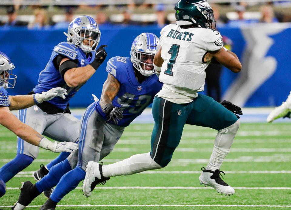 Detroit Lions linebacker Chris Board (49) looks to tackle Philadelphia Eagles quarterback Jalen Hurts (1) during the second half at Ford Field, Sept. 11, 2022.