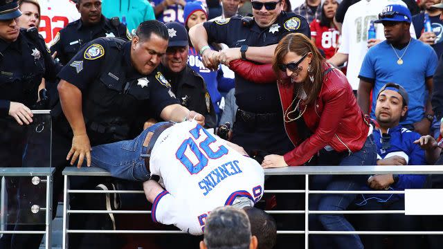 The fan falls from the stands. Pic: Getty