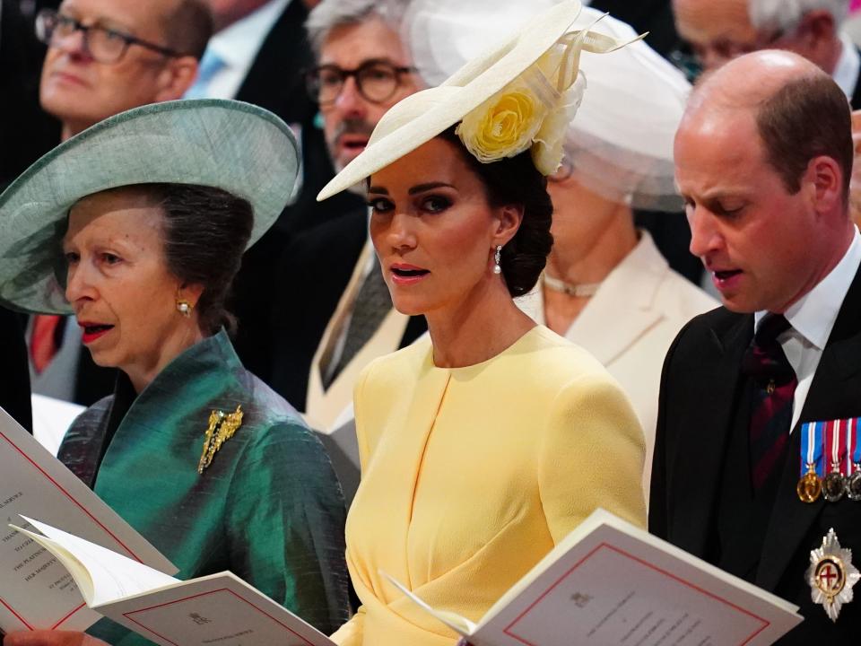 Kate Middleton, Prince William and Princess Anne sing along with choir.