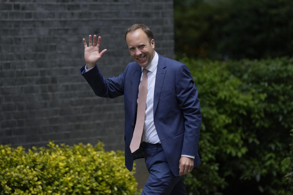 Britain's Health Secretary Matt Hancock waves at members of the media as he walks to go into 10 Downing Street, in London, Monday, June 7, 2021. (AP Photo/Matt Dunham)