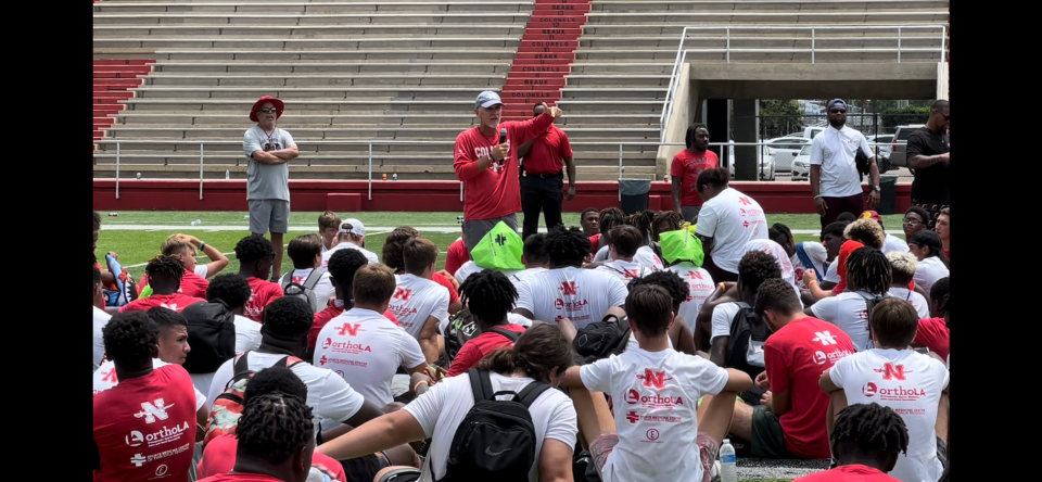 Nicholls coach Tim Rebowe talks to players at the Pro Football Camp on July 22.