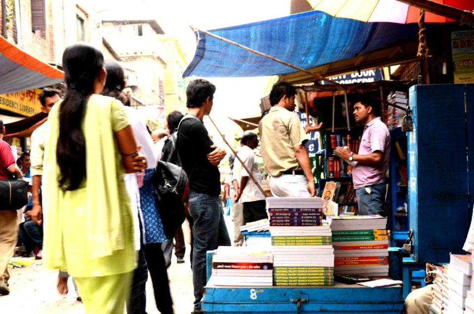 Students buy books on College Street.