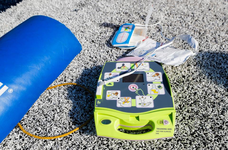 A training Automated External Defibrillator has picture instructions to guide those administering a shock during a cardiac emergency. The device was used during a training session at Shelby County High School on Thursday, July 20, 2023. Coaches from Shelby County High School were being trained on using AEDs before the start of the season following a 2023 law that requires schools to simulate a cardiac emergency response.