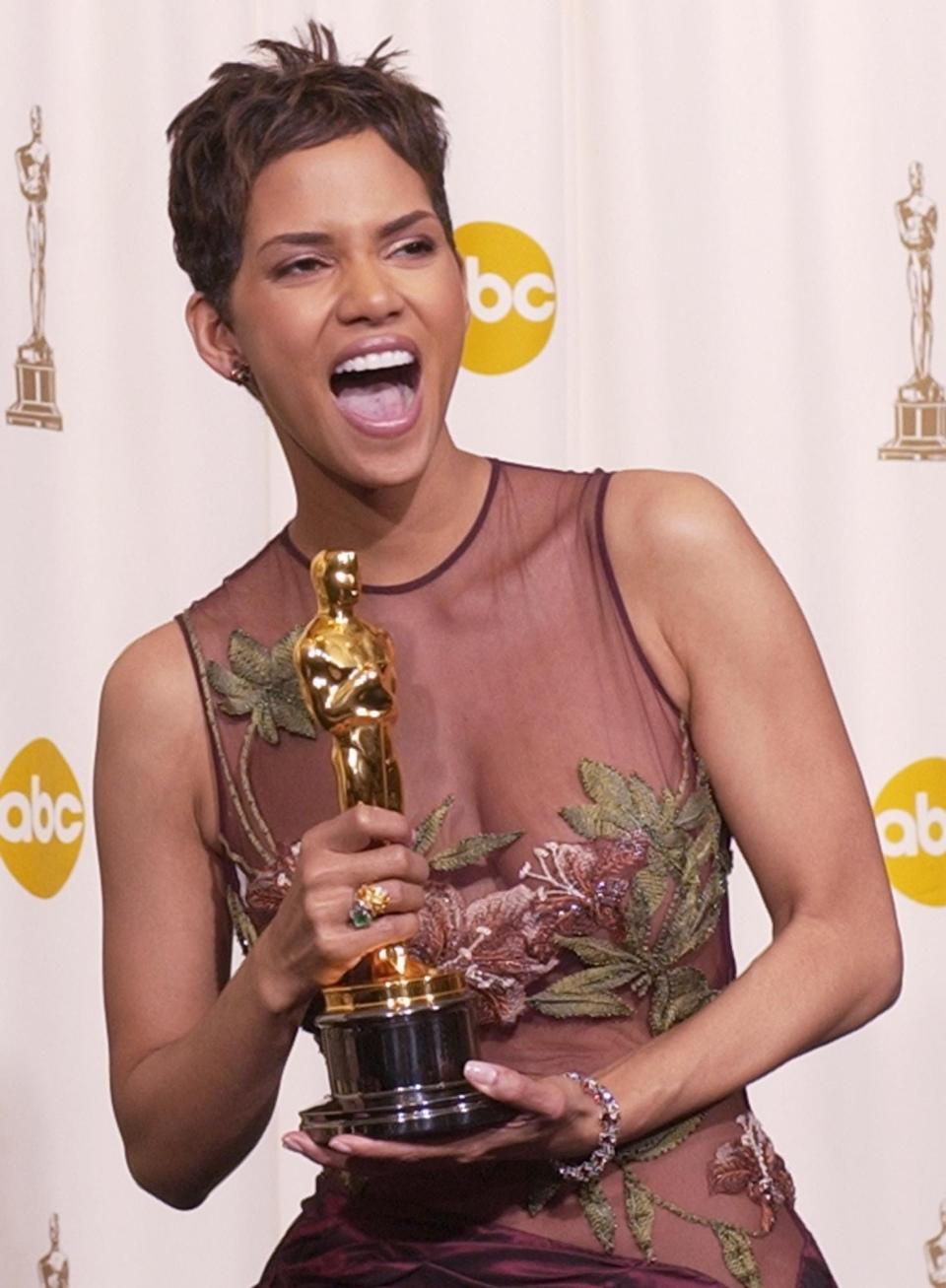 Halle Berry celebrates backstage after winning best actress for her role in "Monster's Ball."