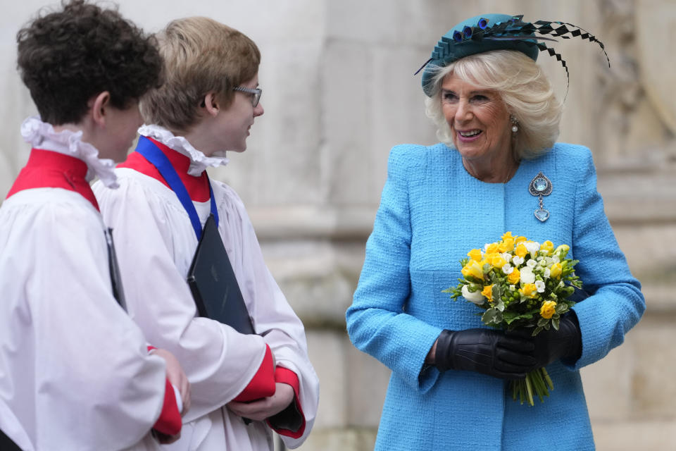 Queen Camilla speaks to some of the choristers as she departs following the annual Commonwealth Day Service of Celebration at Westminster Abbey in London, Monday, March 11, 2024. Commonwealth Day is an annual celebration observed by people all over the Commonwealth in Africa, Asia, the Caribbean and Americas, the Pacific and Europe. (AP Photo/Kirsty Wigglesworth)