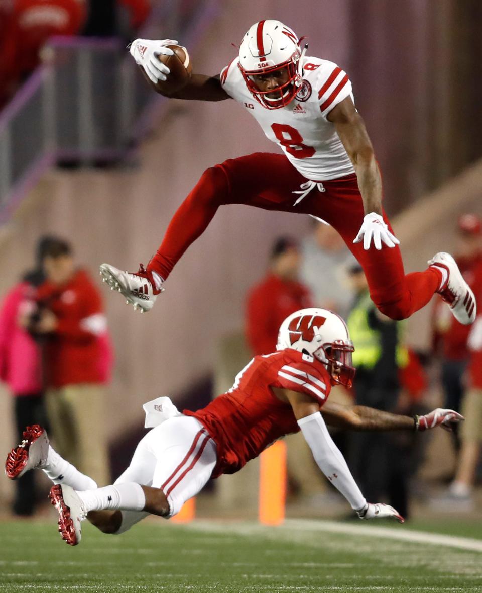 Nebraska wide receiver Stanley Morgan Jr. leaps over Wisconsin cornerback Deron Harrell Saturday, Oct. 6, 2018, at Camp Randall Stadium in Madison, Wis.Danny Damiani/USA TODAY NETWORK-Wisconsin