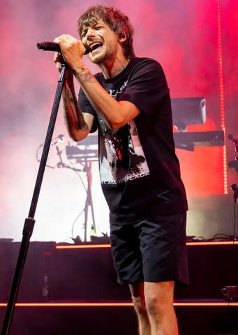 <p>Scott Legato/Getty</p> Louis Tomlinson performs during his Faith In The Future World Tour 2023 on June 02, 2023 in Sterling Heights, Michigan.