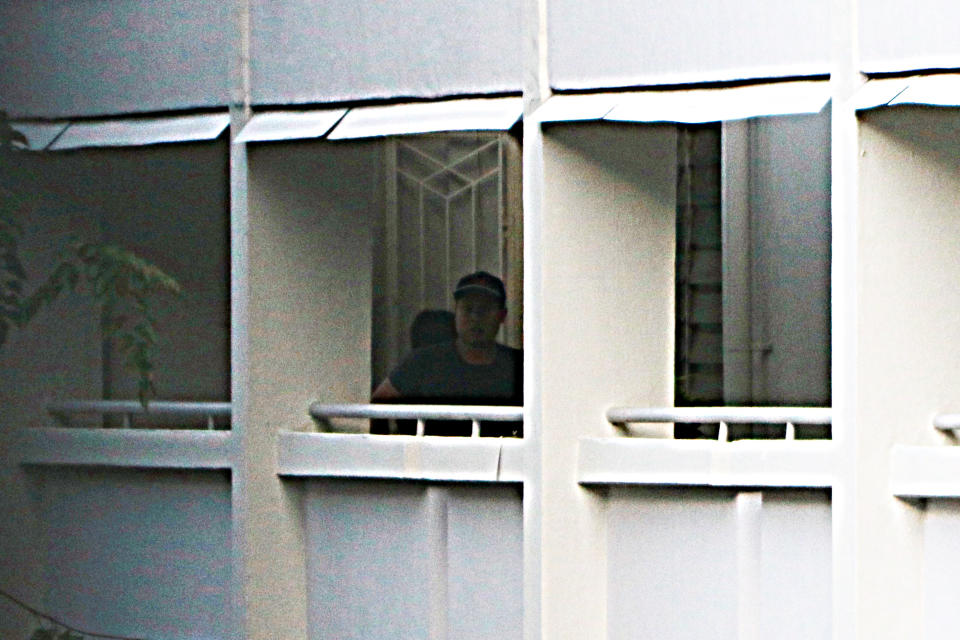A man and woman seen leaving the Hougang flat on 5 October. They parted ways below the block. (PHOTO: Dhany Osman / Yahoo News Singapore)