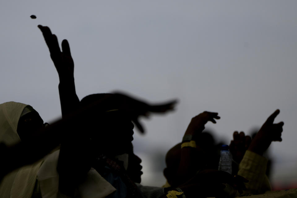 Pilgrims cast stones at a pillar in the symbolic stoning of the devil, the last rite of the annual Hajj pilgrimage, in Mina near the holly city of Mecca, Saudi Arabia, Thursday, June 29, 2023. (AP Photo/Amr Nabil)