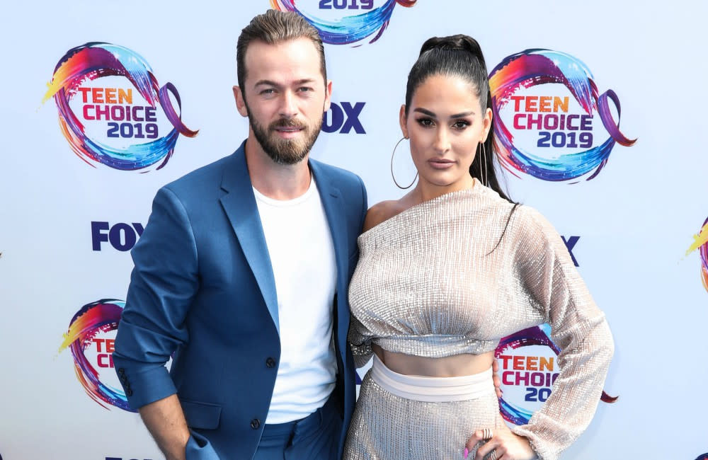 Artem Chigvintsev and Nikki Bella at the Teen Choice Awards credit:Bang Showbiz