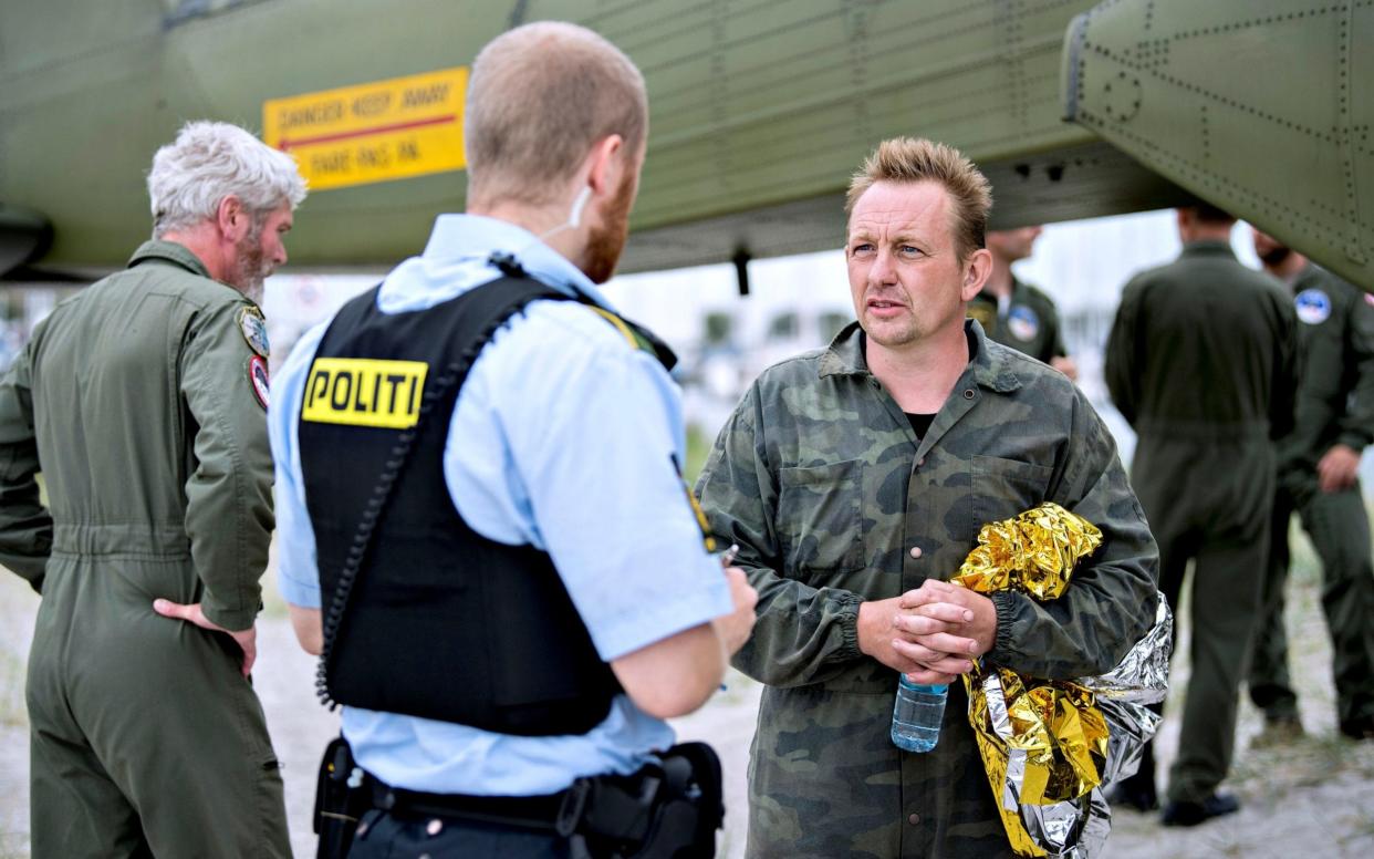 Danish submarine owner and inventor Peter Madsen with Danish police - REUTERS