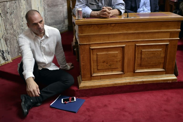 Greek Finance Minister Yianis Varoufakis listens to Prime Minister Tsipras addressing MP's and ministers, at the Greek Parliament in Athens, on June 16, 2015