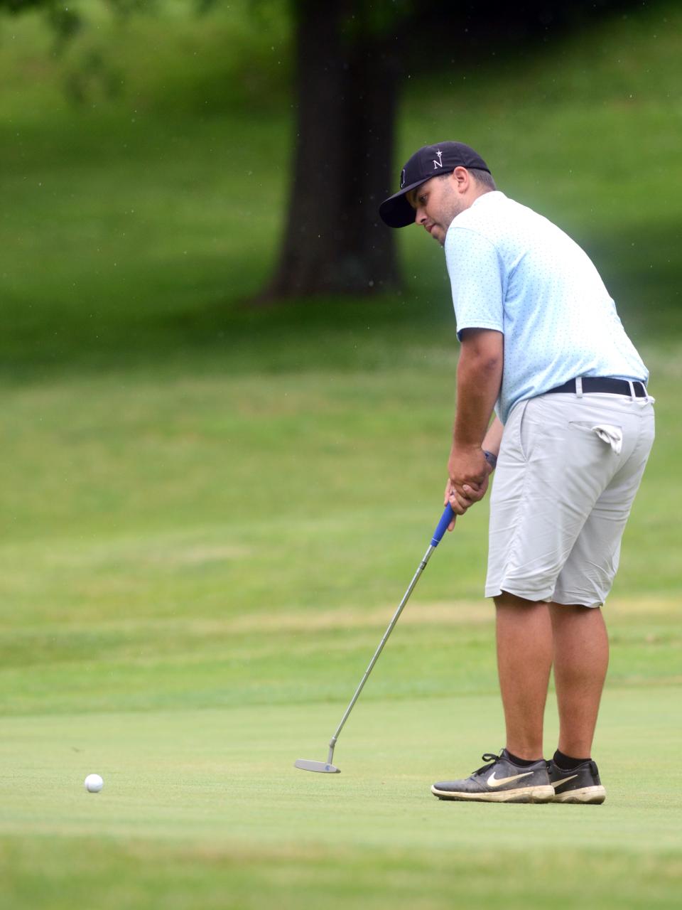 Michael Rozsa, a 2014 Tri-Valley grad, hits his eagle putt on the par-5 18th hole during the second round of the Zanesville District Golf Association Amateur tournament on Sunday at Jaycees. Rozsa shot 72 and is six shots back of the lead entreing the final round on June 18 at Zanesville Country Club.