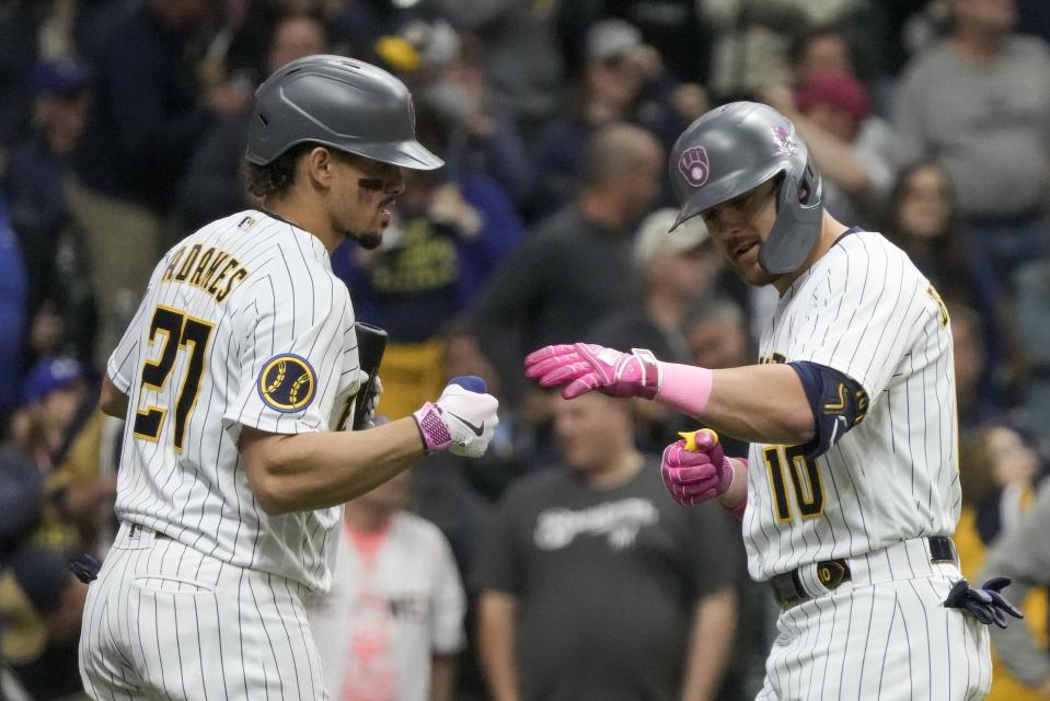 Milwaukee Brewers' Mike Brosseau is congratulted by Willy Adames after hitting a home run during the seventh inning of a baseball game against the Kansas City Royals Sunday, May 14, 2023, in Milwaukee. (AP Photo/Morry Gash)