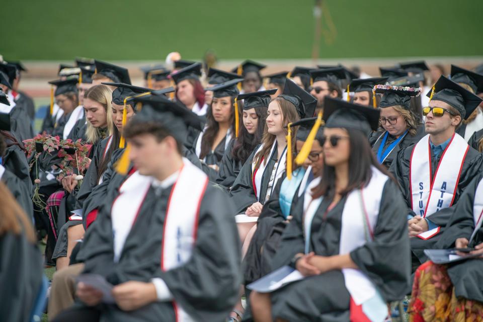 Graduates listen to speakers during the Colorado State University Pueblo commencement ceremony on Saturday, May 13, 2023.