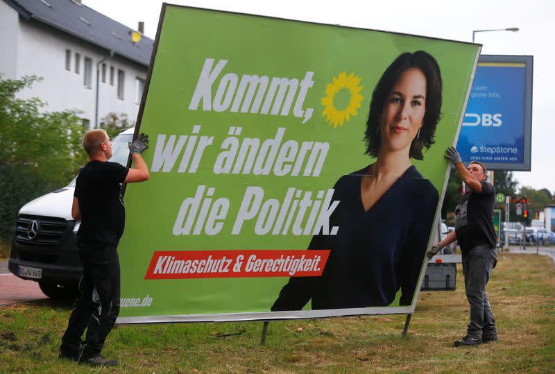 FILE PHOTO: Workers remove election campaign posters after general election in Germany