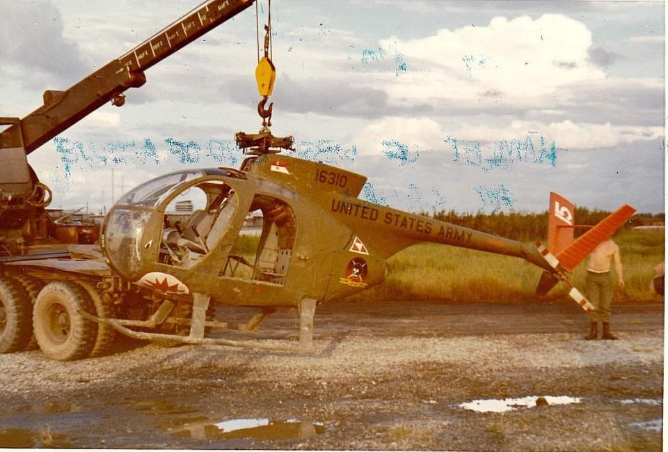 The helicopter that Dave Middleton piloted is sling loaded back to base after the crash.