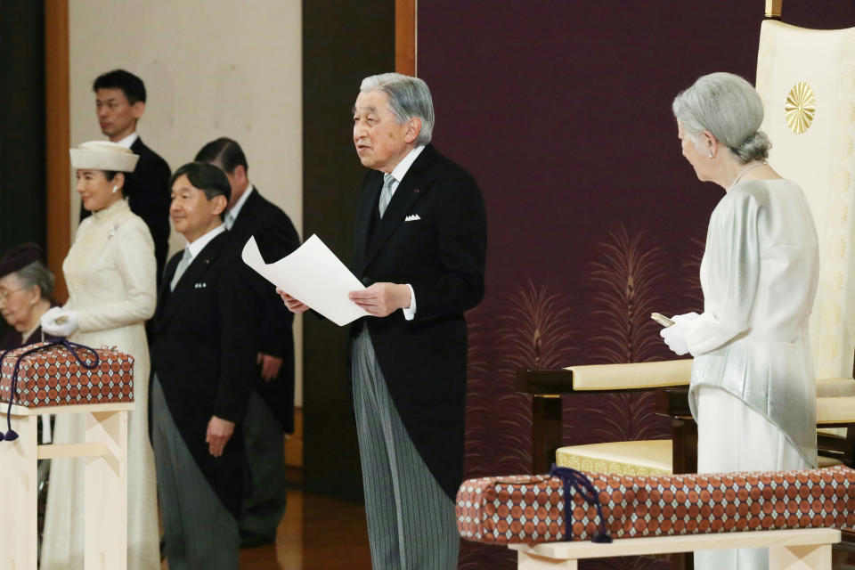 Japan's Emperor Akihito speaks during the ceremony of his abdication in front of other members of the royal families and top government officials at the Imperial Palace in Tokyo, Tuesday, April 30, 2019. The 85-year-old Akihito ends his three-decade reign on Tuesday as his son Crown Prince Naruhito, second from left, will ascend the Chrysanthemum throne on Wednesday. Empress Michiko is at right and Crown Princess Masako is at left. (Japan Pool via AP)