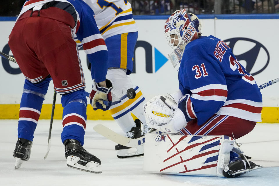 New York Rangers goaltender Igor Shesterkin (31) makes a save during the second period of an NHL hockey game against the Buffalo Sabres, Monday, April 10, 2023, in New York. (AP Photo/John Minchillo)