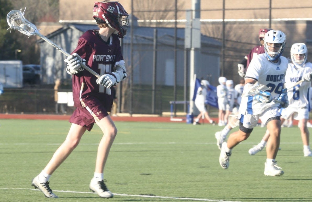 Portsmouth High School freshman Gus Baker looking for an opening during the Clippers' 14-7 Division II win over Oyster River on Monday at Oyster River High School.