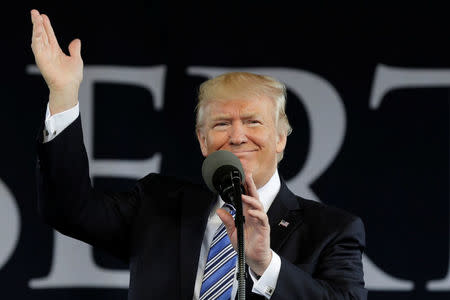 U.S. President Donald Trump waves before delivering keynote address at Liberty University's commencement in Lynchburg, Virginia, U.S., May 13, 2017. REUTERS/Yuri Gripas