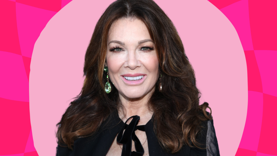 Lisa Vanderpump wearing a black top against a pink background