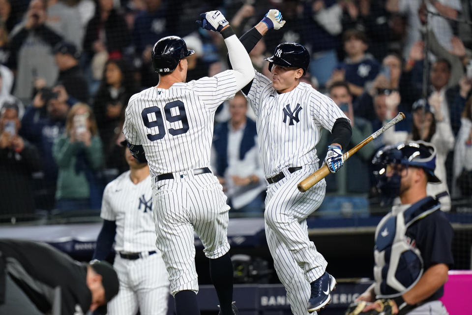 New York Yankees' Aaron Judge, left, celebrates with Anthony Rizzo after hitting a home run during the fifth inning of the team's baseball game against the Cleveland Guardians on Friday, April 22, 2022, in New York. (AP Photo/Frank Franklin II)