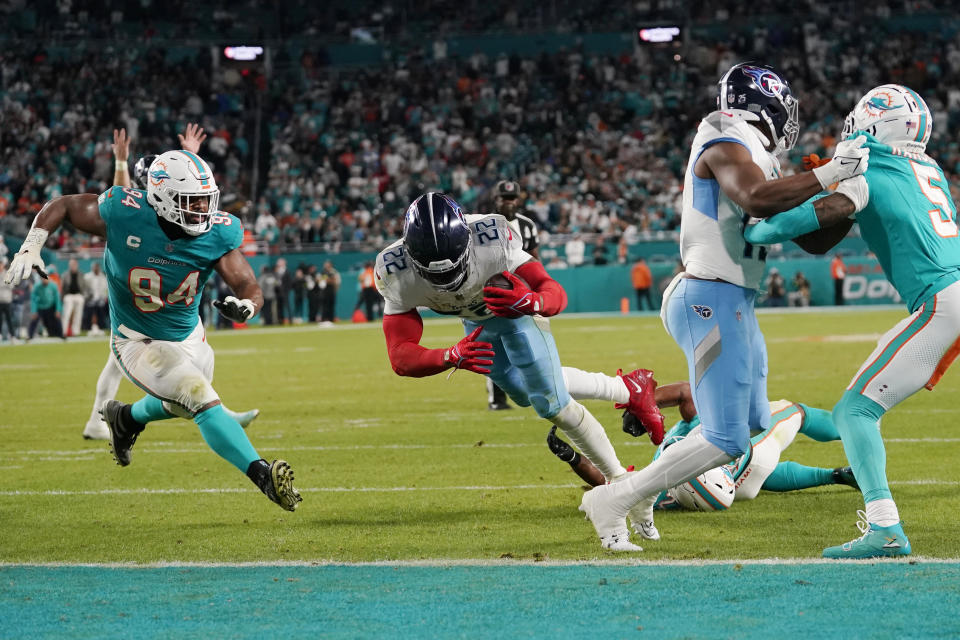 Tennessee Titans running back Derrick Henry (22) scores a touchdown during the second half of an NFL football game against the Miami Dolphins, Monday, Dec. 11, 2023, in Miami. (AP Photo/Lynne Sladky)