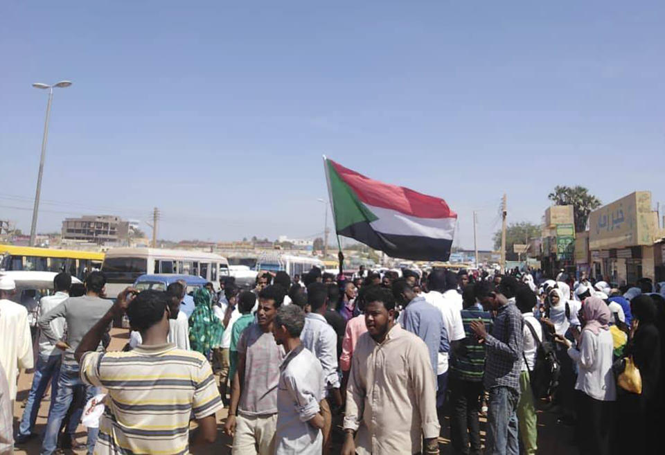 Protesters march in Wad Madani, the provincial capital of al-Jazirah province, Sudan, Sunday, Nov. 3, 2019. Hundreds of protesters took to the streets in Sudan's capital and across the country on Sunday, demanding the disbanding of the former ruling party that underpinned Sudanese President Omar al-Bashir's three decades in power. (The Madani’s Resistance Committee via AP)