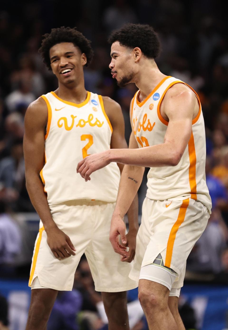 Former Tennessee players Julian Phillips (2) and Olivier Nkamhoua celebrate March 18, 2023, after the Vols defeated the Duke Blue Devils in the second round of the 2023 NCAA Tournament.