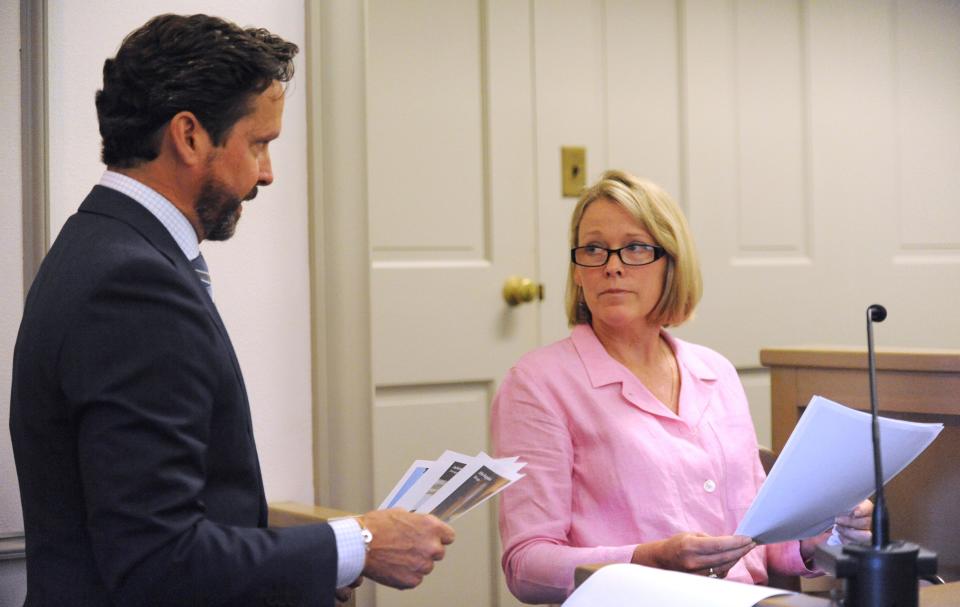 Kevin Spacey's attorney Alan Jackson, left, presents photos to witness Heather Unruh, the accuser's mother, in Nantucket District Court Monday, July 8, 2019.